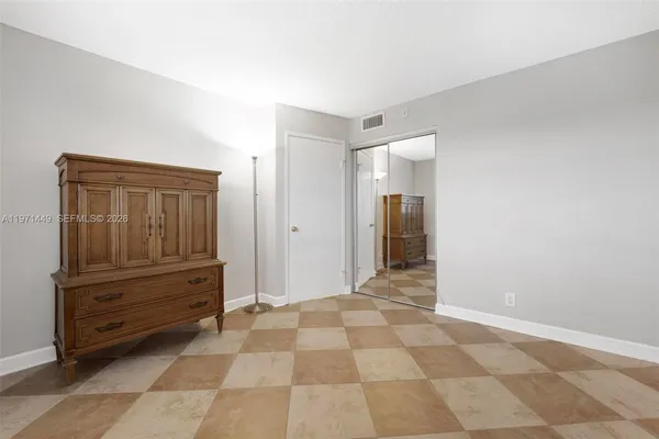 a view of a closet area with cabinet