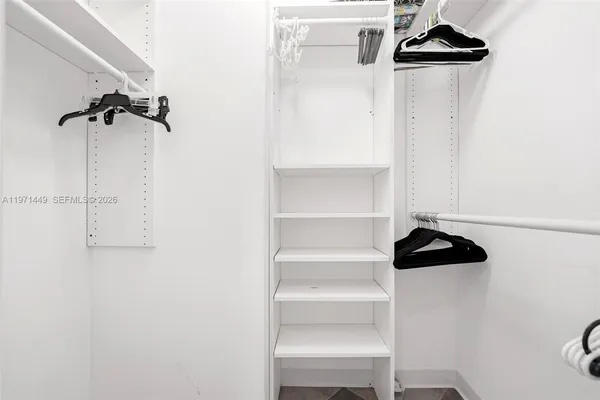 a view of a closet with storage