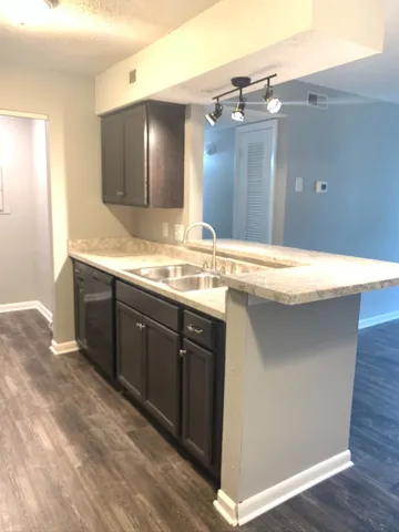 a bathroom with a sink vanity and a mirror