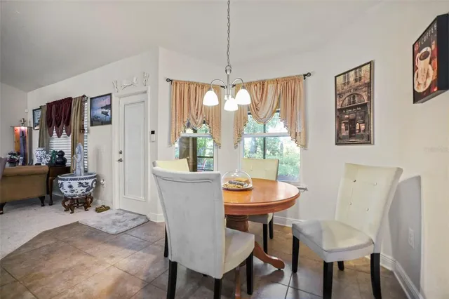 a kitchen with stainless steel appliances granite countertop a sink counter space cabinets and a large window