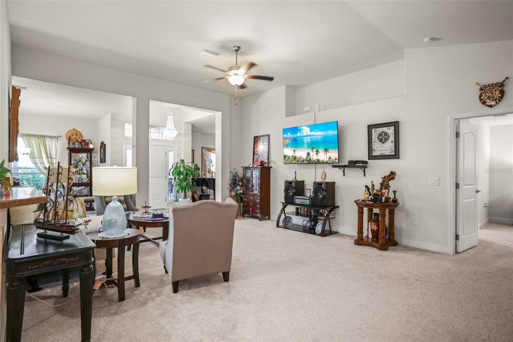 190 Rusk Circle Spring Hill, FL 34606 - Photo 25 of 35 a living room with furniture and a flat screen tv