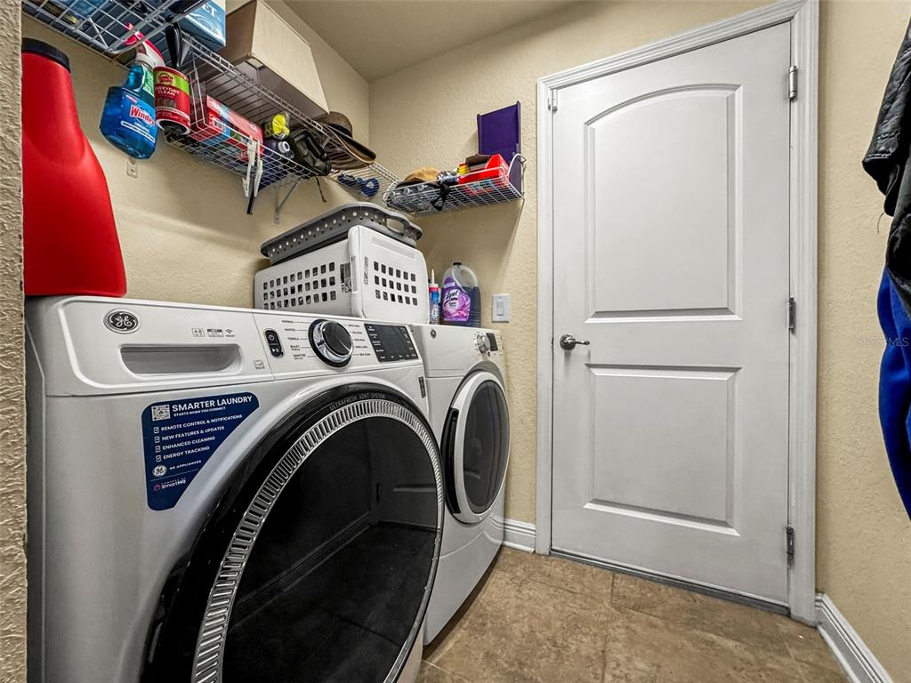 190 Rusk Circle Spring Hill, FL 34606 - Photo 34 of 35 a utility room with dryer and washer