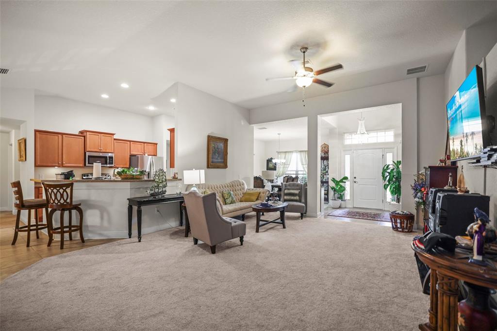 190 Rusk Circle Spring Hill, FL 34606 - Photo 4 of 35 a living room with lots of furniture and a large window