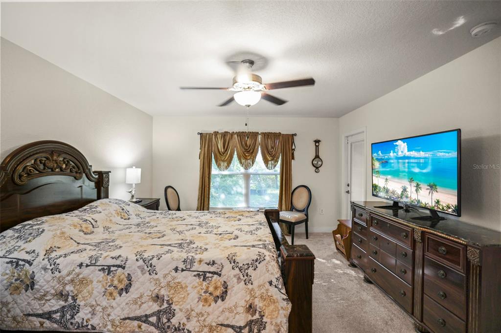 190 Rusk Circle Spring Hill, FL 34606 - Photo 6 of 35 a bedroom with a bed and a flat screen tv