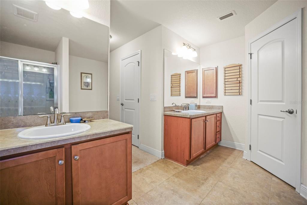 190 Rusk Circle Spring Hill, FL 34606 - Photo 7 of 35 a bathroom with a granite countertop sink and a mirror