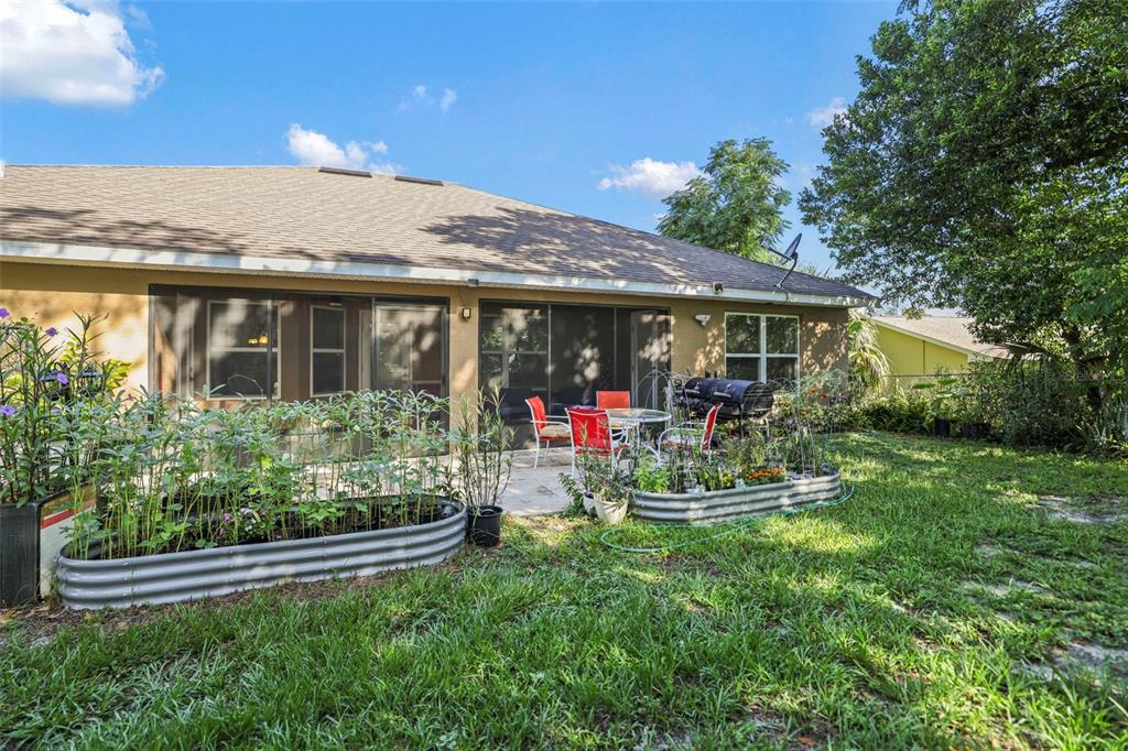 190 Rusk Circle Spring Hill, FL 34606 - Photo 9 of 35 a view of a house with sitting area and garden