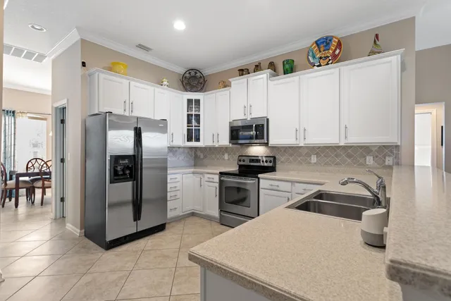 a kitchen with a sink stove and microwave