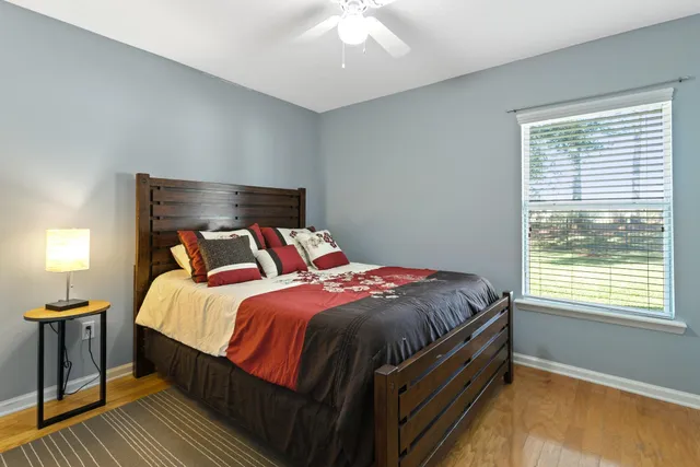 a bedroom with a large bed and a window