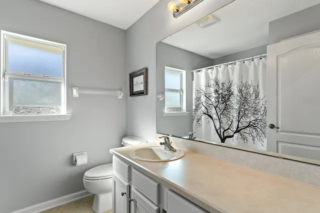 a bathroom with a tub a sink and a shower