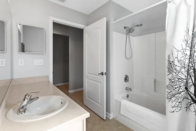 a living room with patio furniture and garden