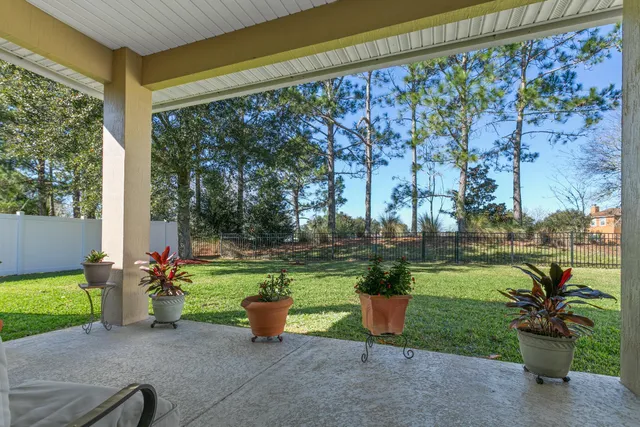 a view of backyard with patio