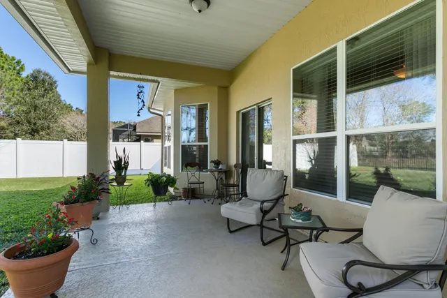 a view of a house with a garden and plants