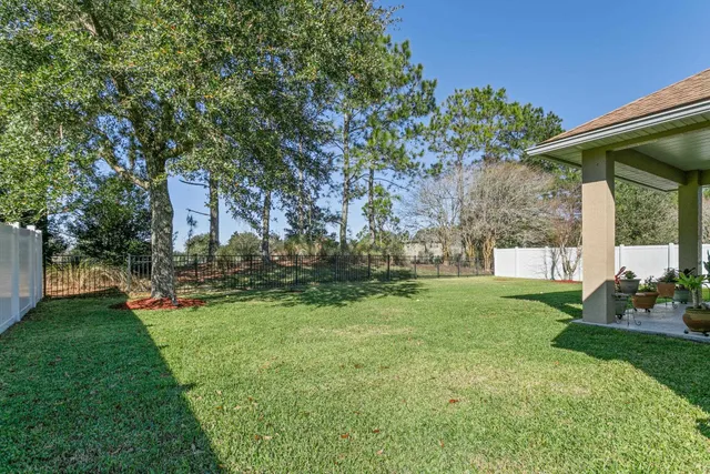 an aerial view of a house with a swimming pool