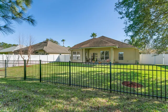 an aerial view of a house with outdoor space swimming pool and lake view