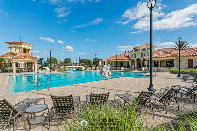 a view of a lake with houses in the background