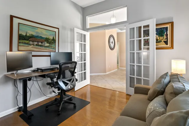 a kitchen with a sink a refrigerator and cabinets