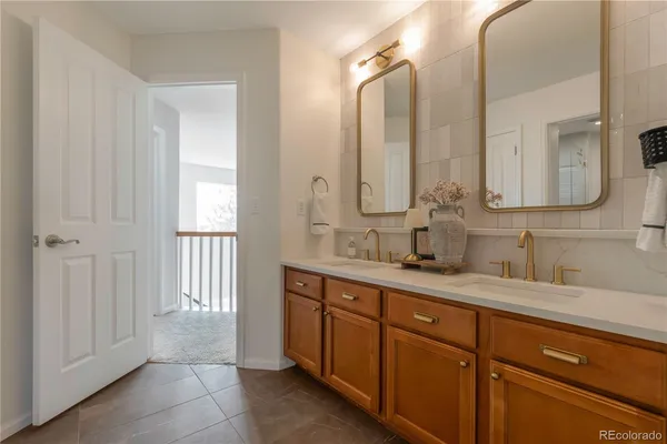 a spacious bathroom with a double vanity sink mirror and