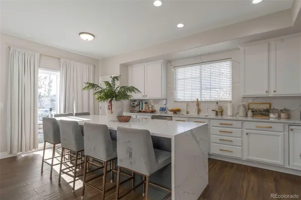 a kitchen with a table and chairs in it