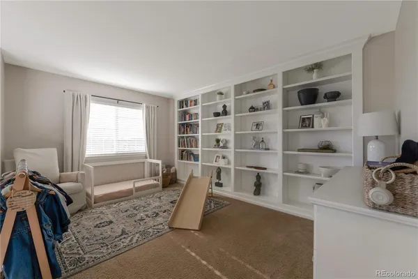 a view of a kitchen with a sink and wooden floor