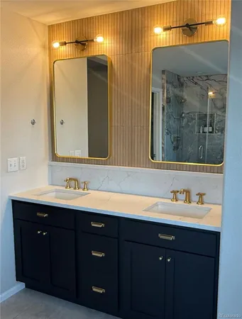 a bathroom with a double vanity sink and a mirror
