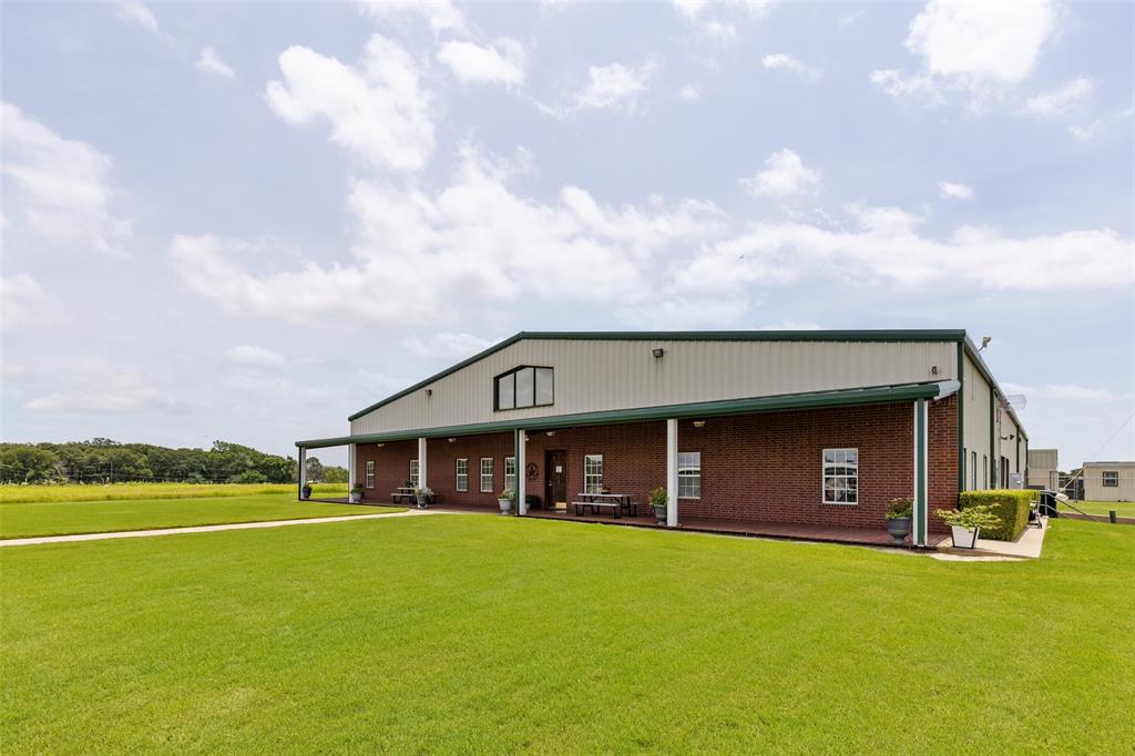 1001 S Highway Pilot Point, TX 76258 - Photo 14 of 16 a front view of a house with a yard and garage