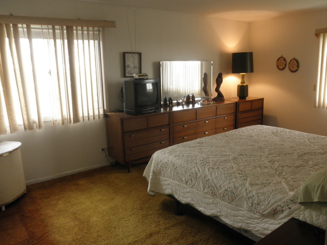 725 West Huntington Commons Road, Unit 419 Mount Prospect, IL 60056 - Photo 14 of 20 a bedroom with a bed and window