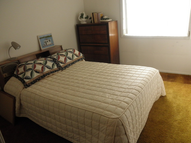 725 West Huntington Commons Road, Unit 419 Mount Prospect, IL 60056 - Photo 16 of 20 a bedroom with a bed and a closet