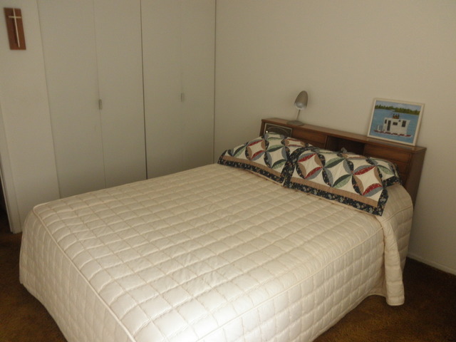 725 West Huntington Commons Road, Unit 419 Mount Prospect, IL 60056 - Photo 17 of 20 a large bed sitting in a bedroom next to a window
