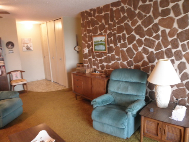725 West Huntington Commons Road, Unit 419 Mount Prospect, IL 60056 - Photo 8 of 20 a living room with furniture and a window