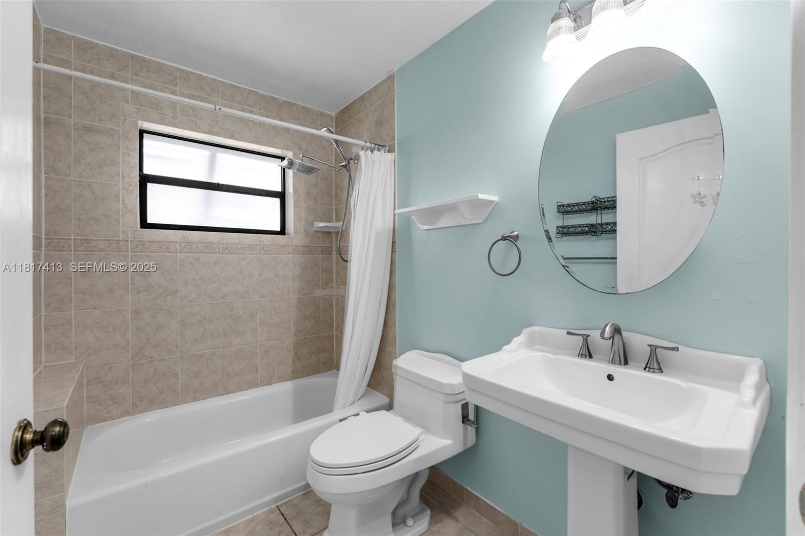16040 Southwest 287th Street Homestead, FL 33033 - Photo 11 of 48 a bathroom with a sink toilet and a bathtub