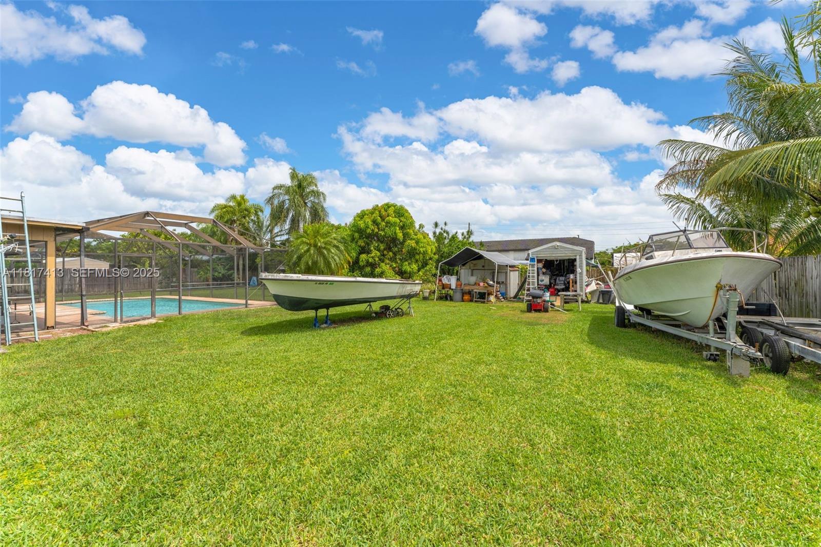 16040 Southwest 287th Street Homestead, FL 33033 - Photo 18 of 48 a front view of a house with garden