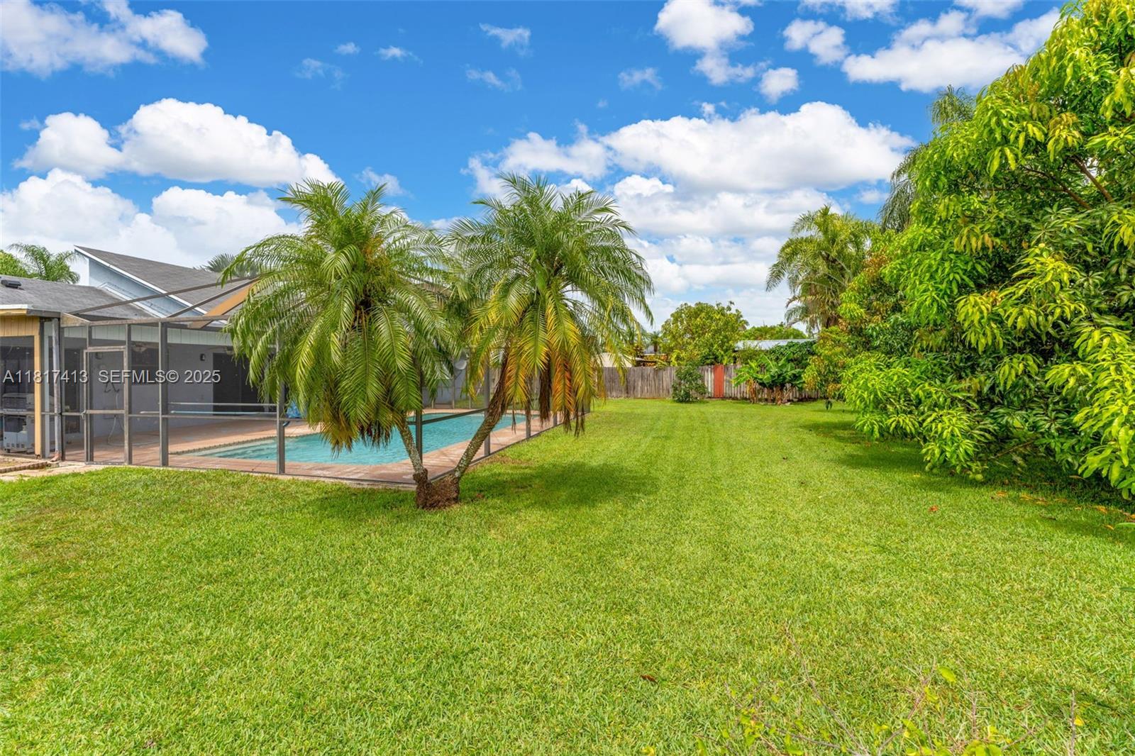 16040 Southwest 287th Street Homestead, FL 33033 - Photo 19 of 48 a view of a garden and trees