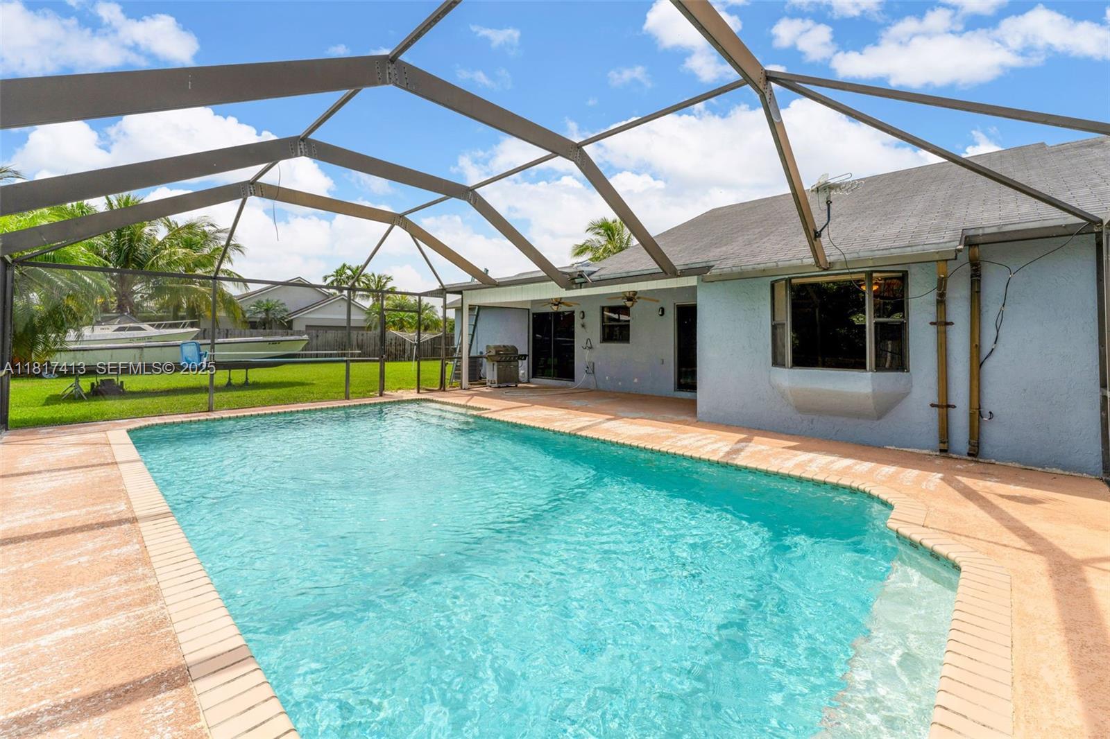 16040 Southwest 287th Street Homestead, FL 33033 - Photo 27 of 48 a view of a house with a swimming pool
