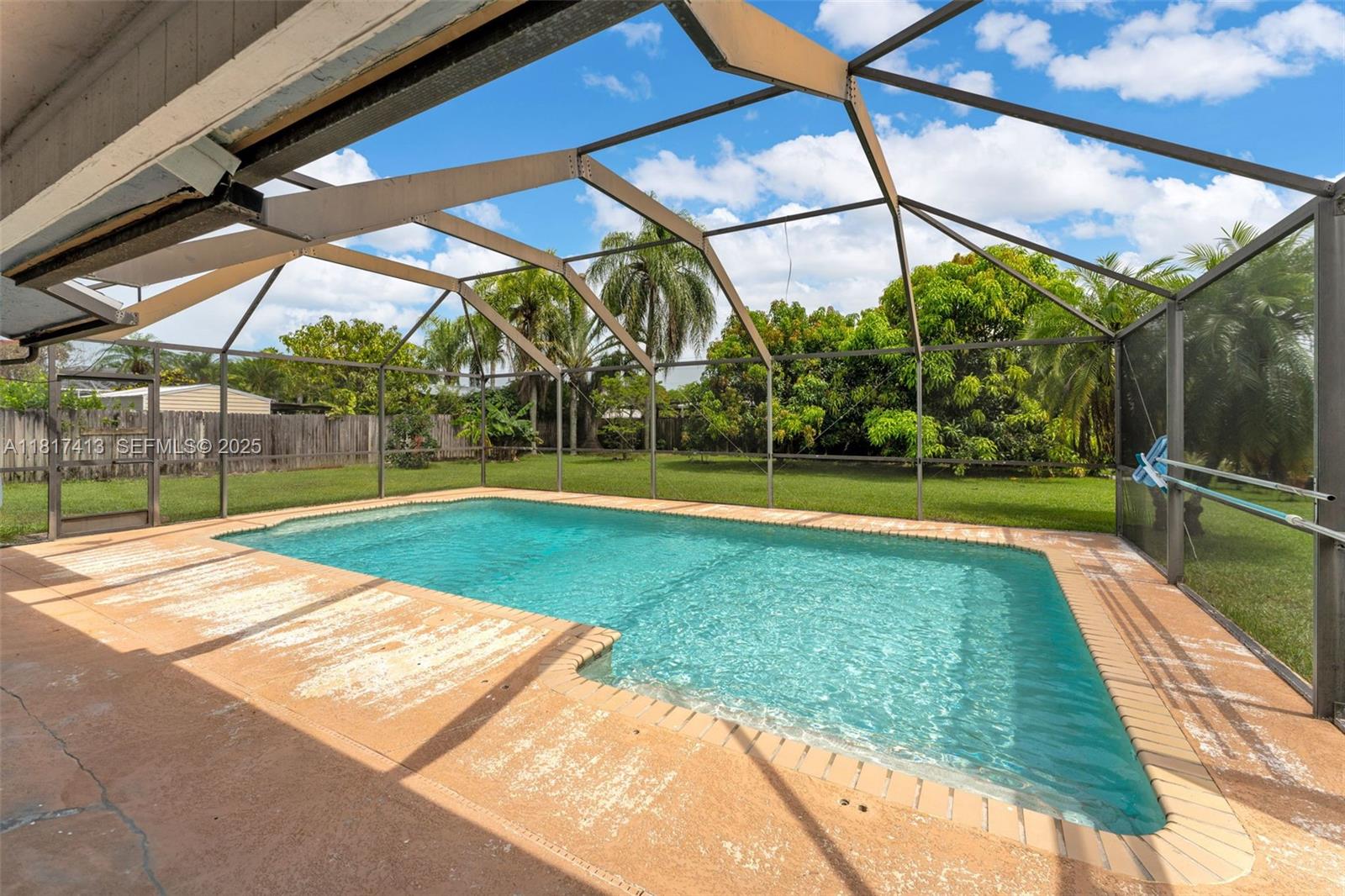 16040 Southwest 287th Street Homestead, FL 33033 - Photo 28 of 48 a view of a backyard with swimming pool