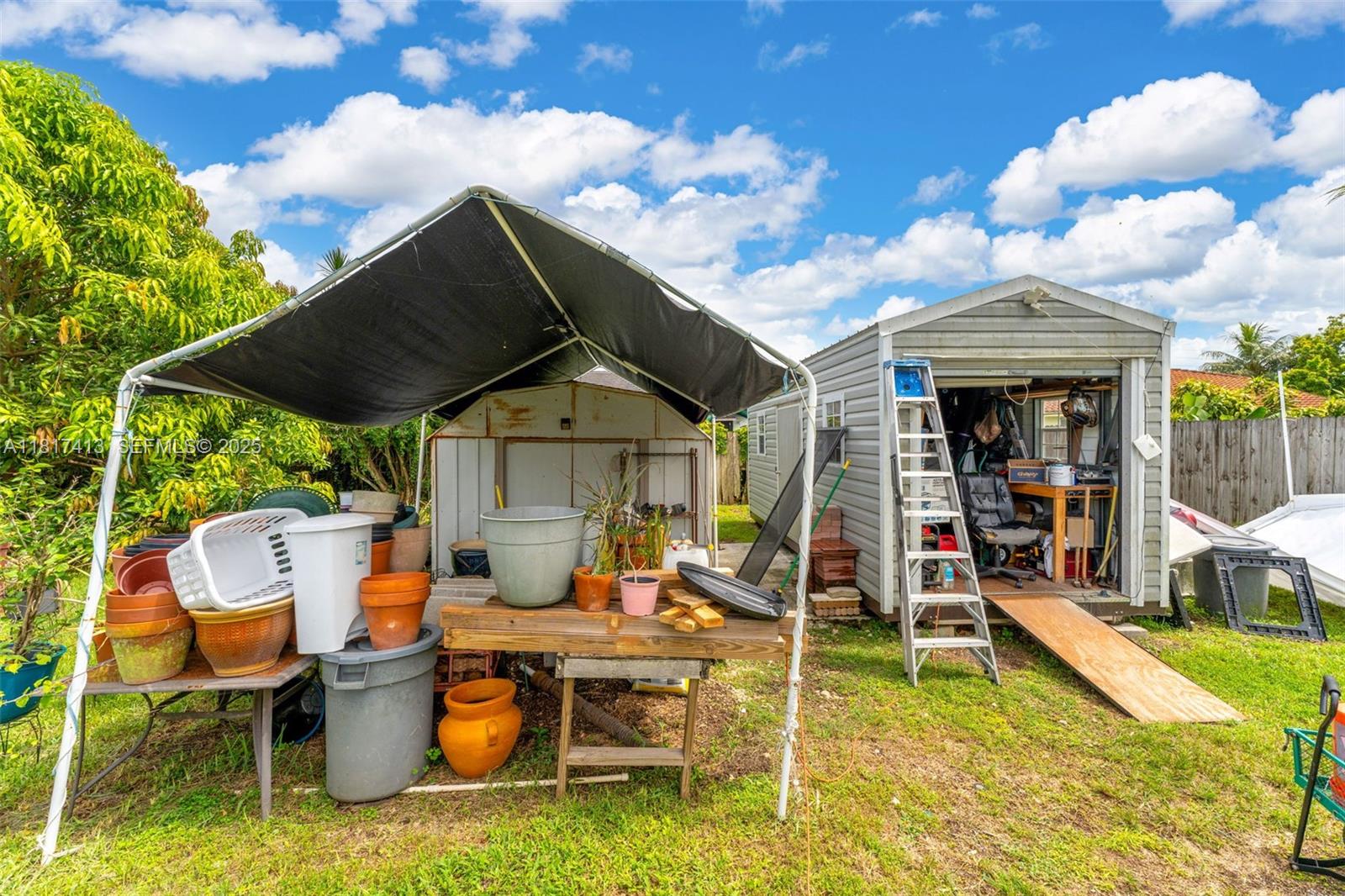 16040 Southwest 287th Street Homestead, FL 33033 - Photo 29 of 48 a front view of a house with swimming pool and furniture