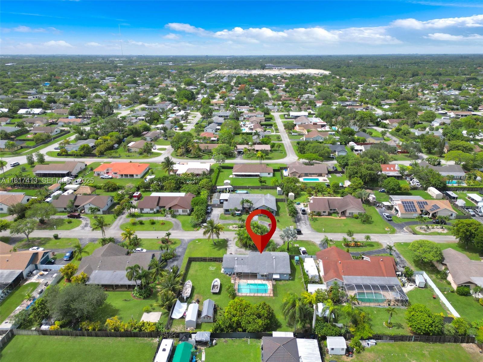 16040 Southwest 287th Street Homestead, FL 33033 - Photo 40 of 48 an aerial view of residential houses with outdoor space and trees
