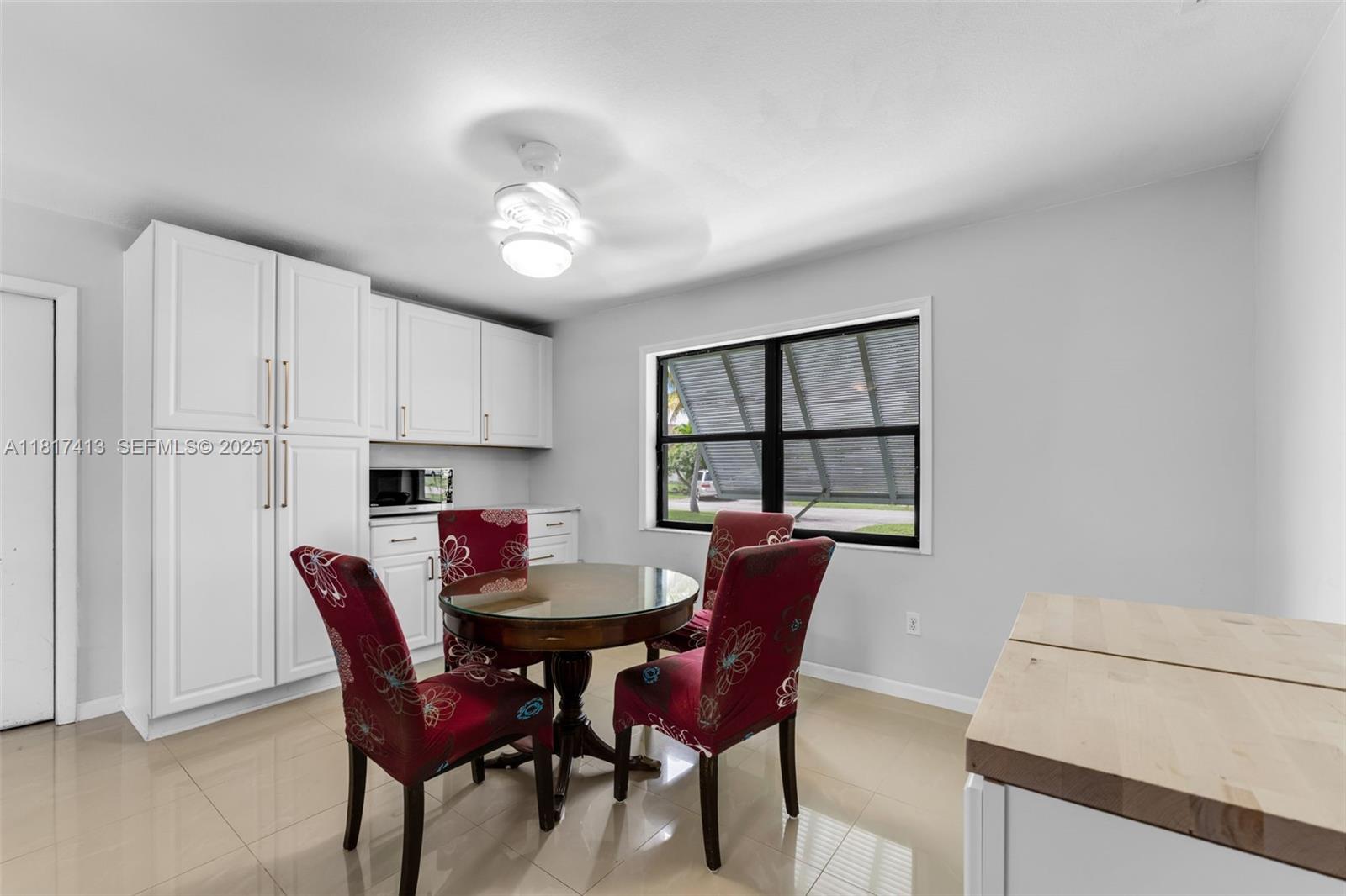 16040 Southwest 287th Street Homestead, FL 33033 - Photo 7 of 48 a view of a dining room with furniture and window