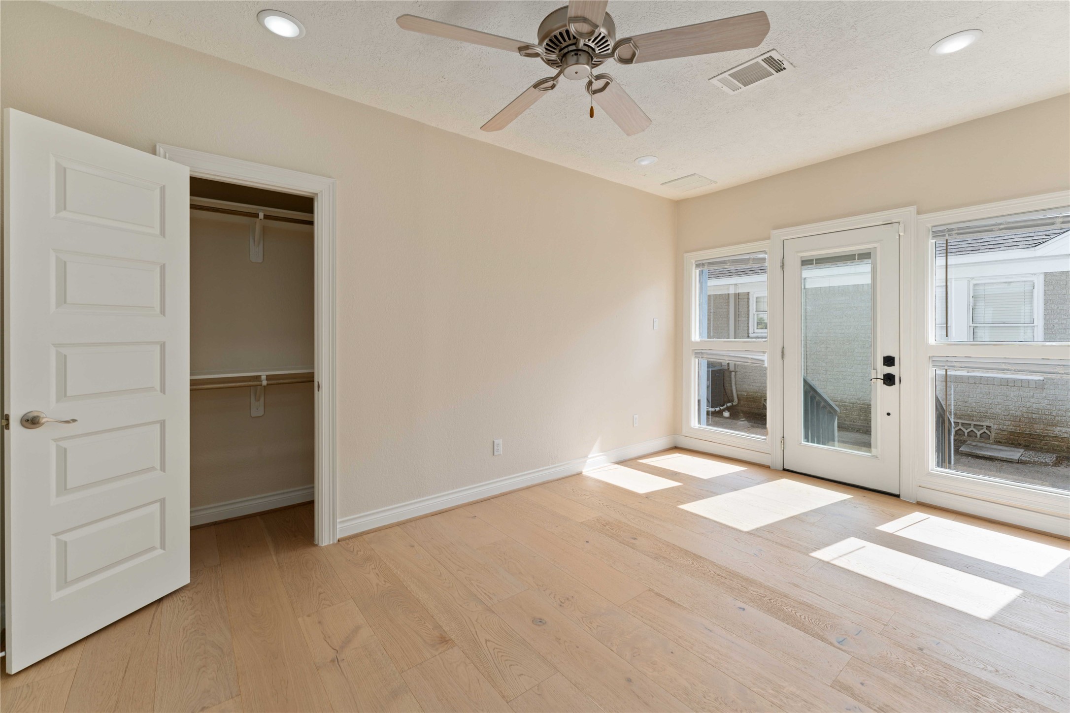 2631 Persa Street Houston, TX 77098 - Photo 13 of 25 a view of an empty room with a fireplace and a window