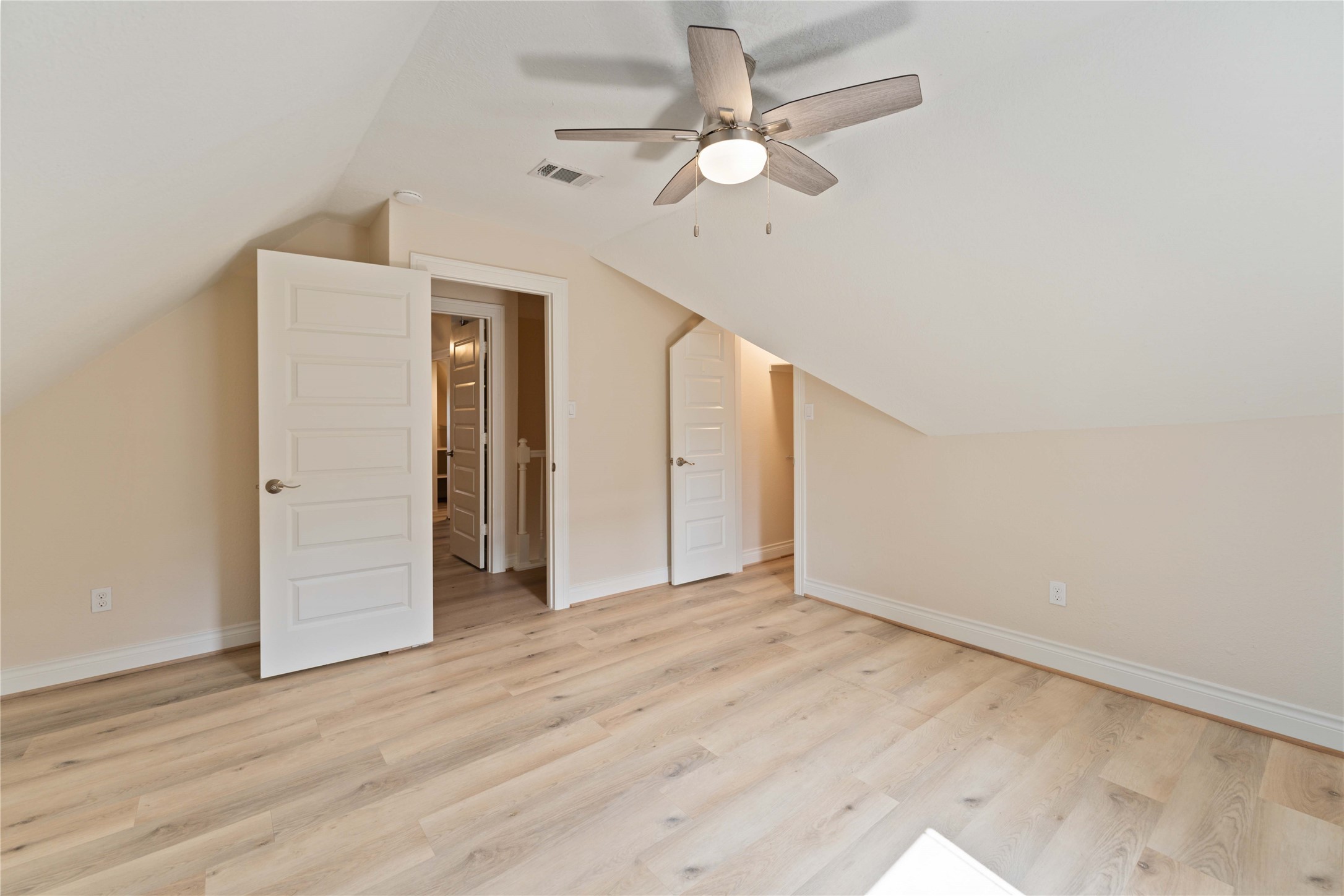 2631 Persa Street Houston, TX 77098 - Photo 19 of 25 a view of an empty room with wooden floor