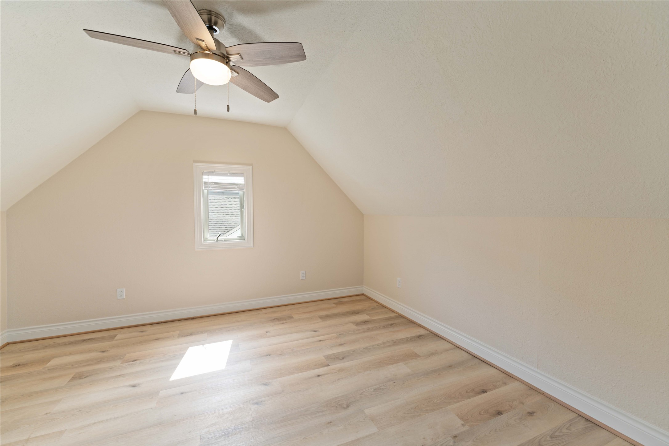 2631 Persa Street Houston, TX 77098 - Photo 21 of 25 an empty room with a window and ceiling fan