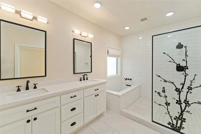 a spacious bathroom with a double vanity sink mirror and double