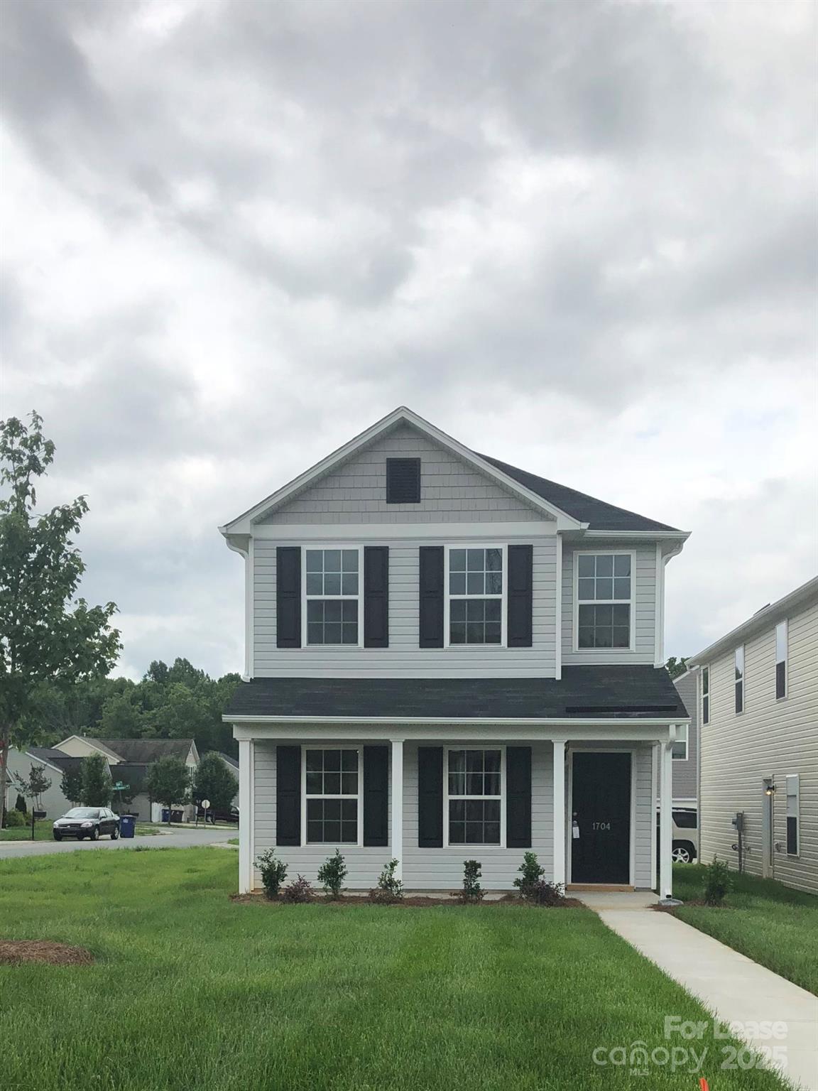 front view of a house with a yard