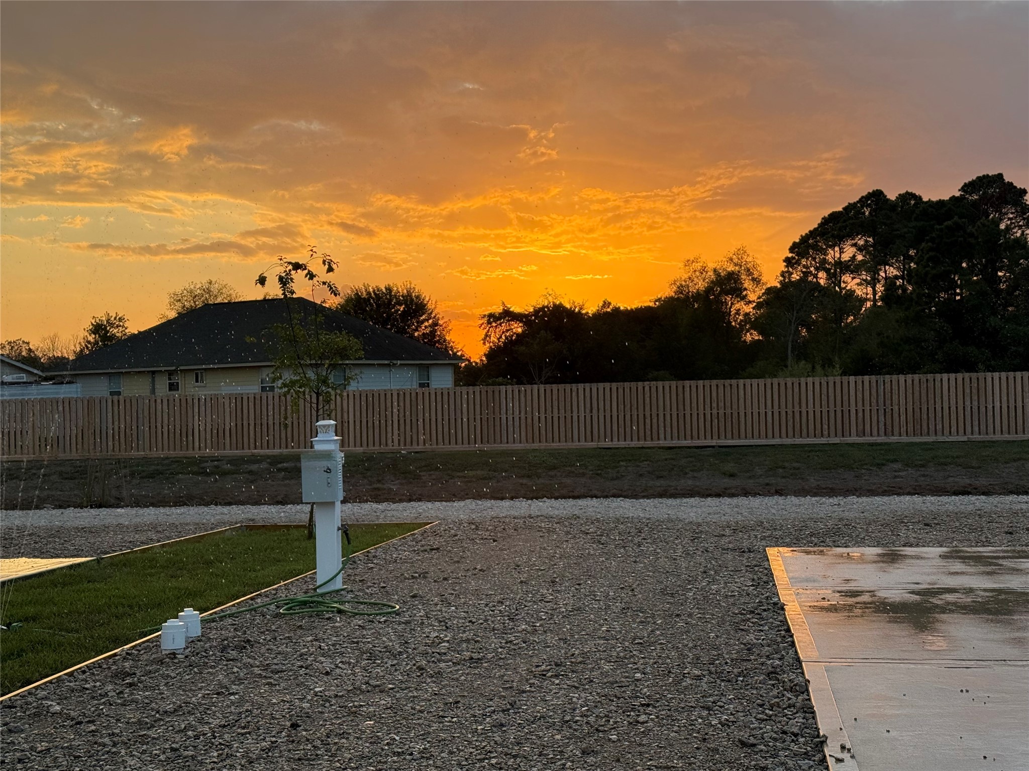 17310 Cowan Road Alvin, TX 77511 - Photo 7 of 9 a view of a backyard with wooden fence