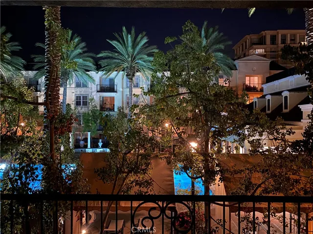 a view of a house with a tree in the background
