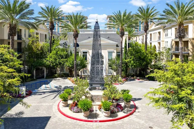 a front view of multi story residential apartment building with yard