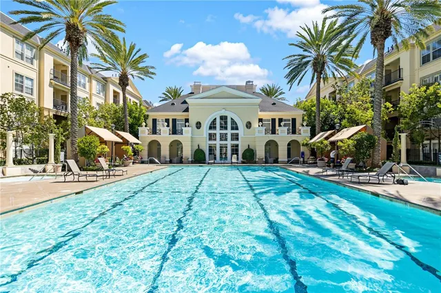 a view of a building with sitting area and furniture