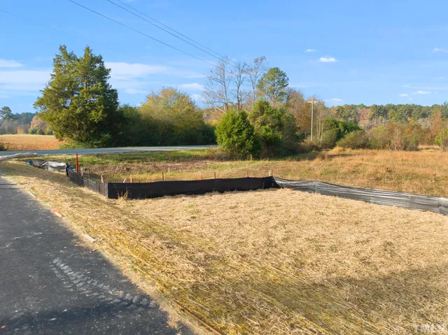 a view of a large body of water with a building in the background