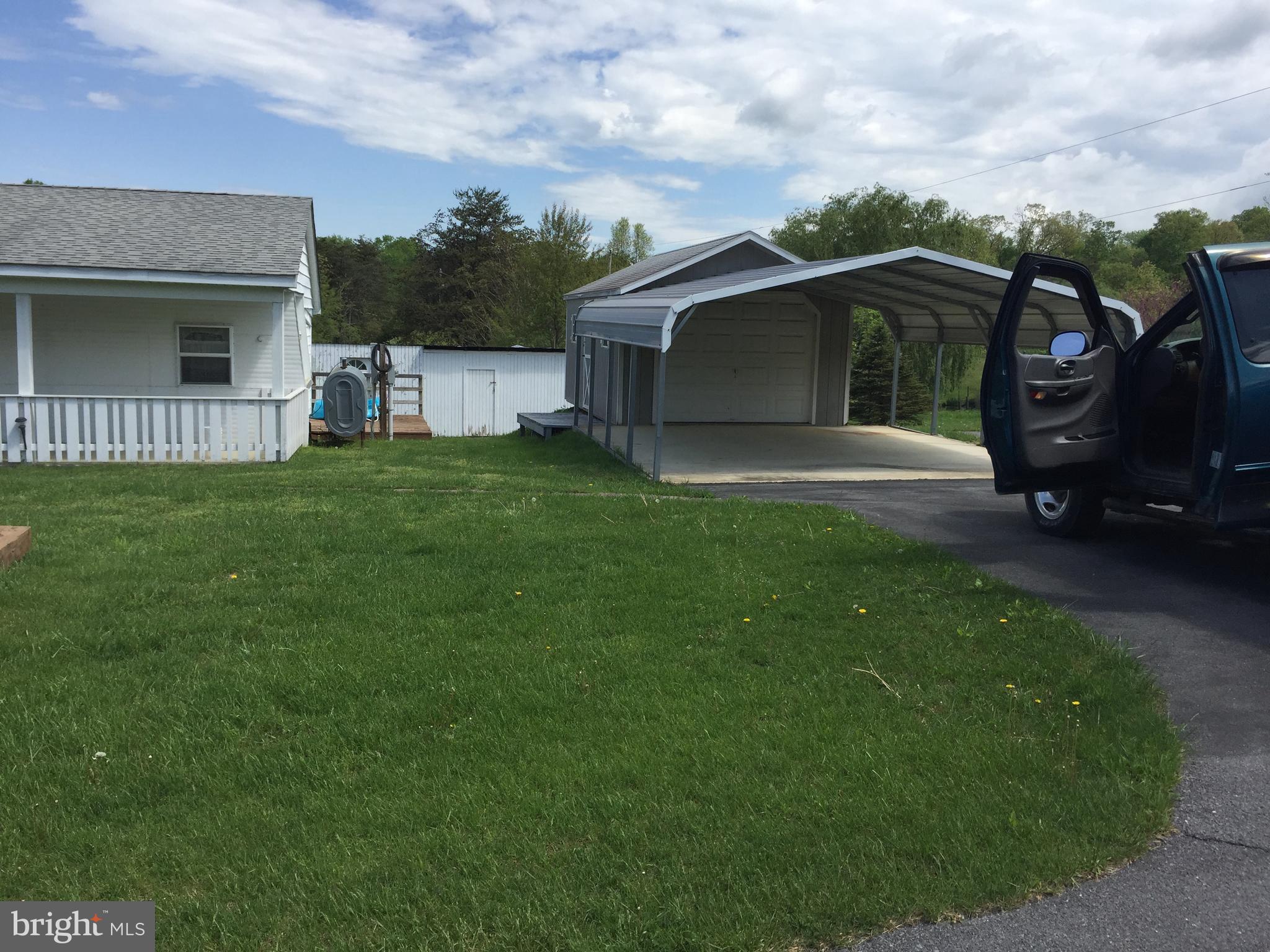 198 Packing House Road Berkeley Springs, WV 25411 - Photo 2 of 53 Front garage and carport