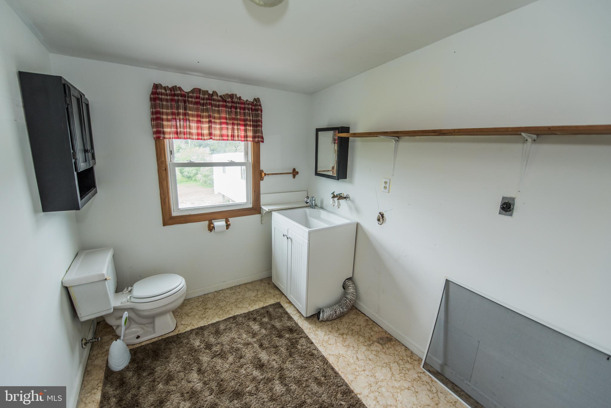 198 Packing House Road Berkeley Springs, WV 25411 - Photo 42 of 53 Half Bath and Laundry hookup