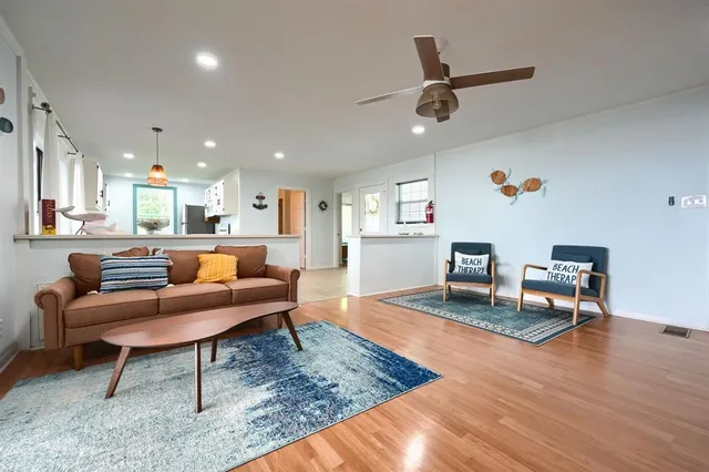 a living room with furniture and a rug